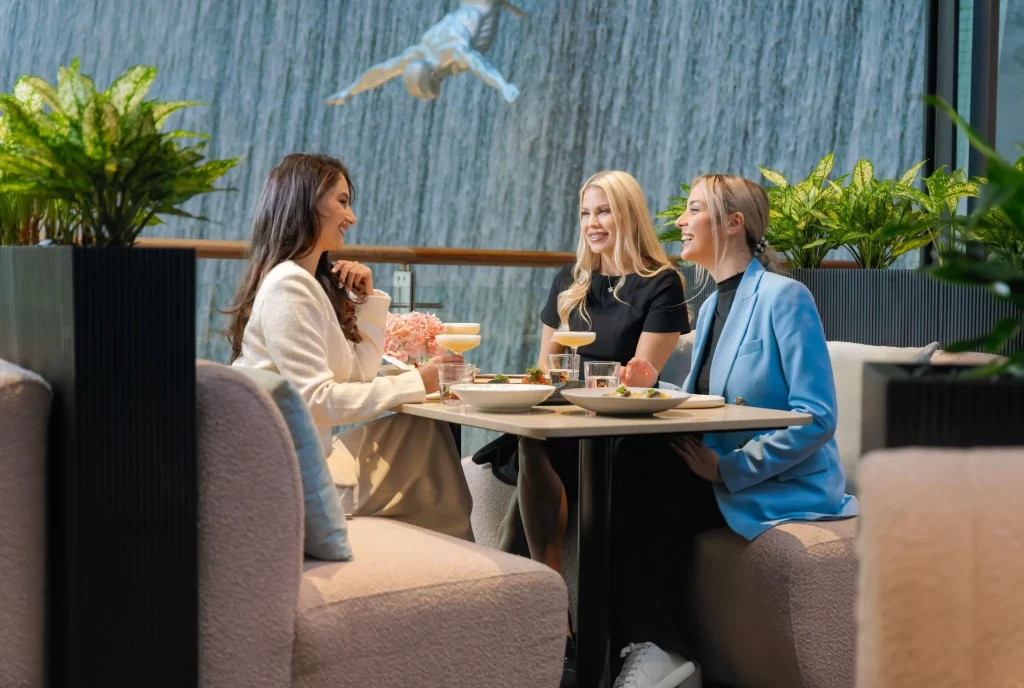 Three women having food at a good restaurant