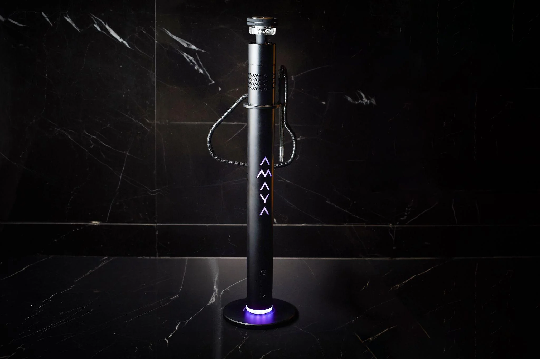  An advanced black-colored shisha in a black background  
