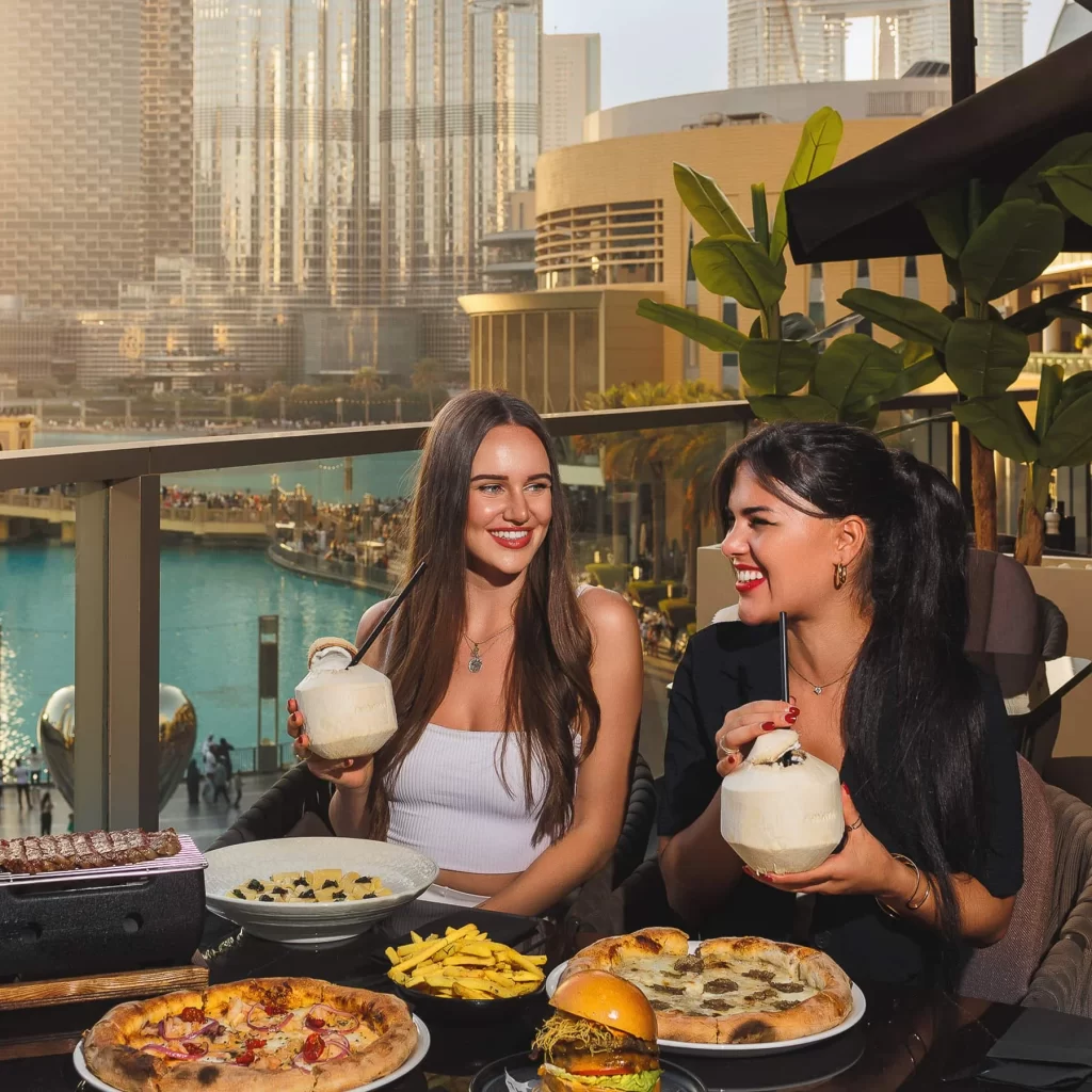 Two women having lunch in the outdoor space